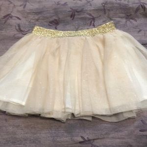 Girls gold and sparkle lined skort (built-in shorts). Like new condition. Size 4